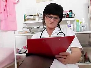 Brunette practical nurse examining her vagina